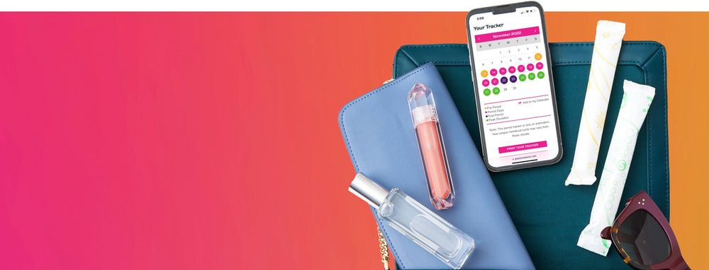 personal products, including wallet, tampons and make-up spread out with Playtex® Period Tracker displayed on mobile phone.